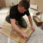 Wat kost het laten leggen van een visgraat vloer?
