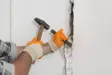 Hoeveel kost het om een binnen​​muur te laten verwijderen?