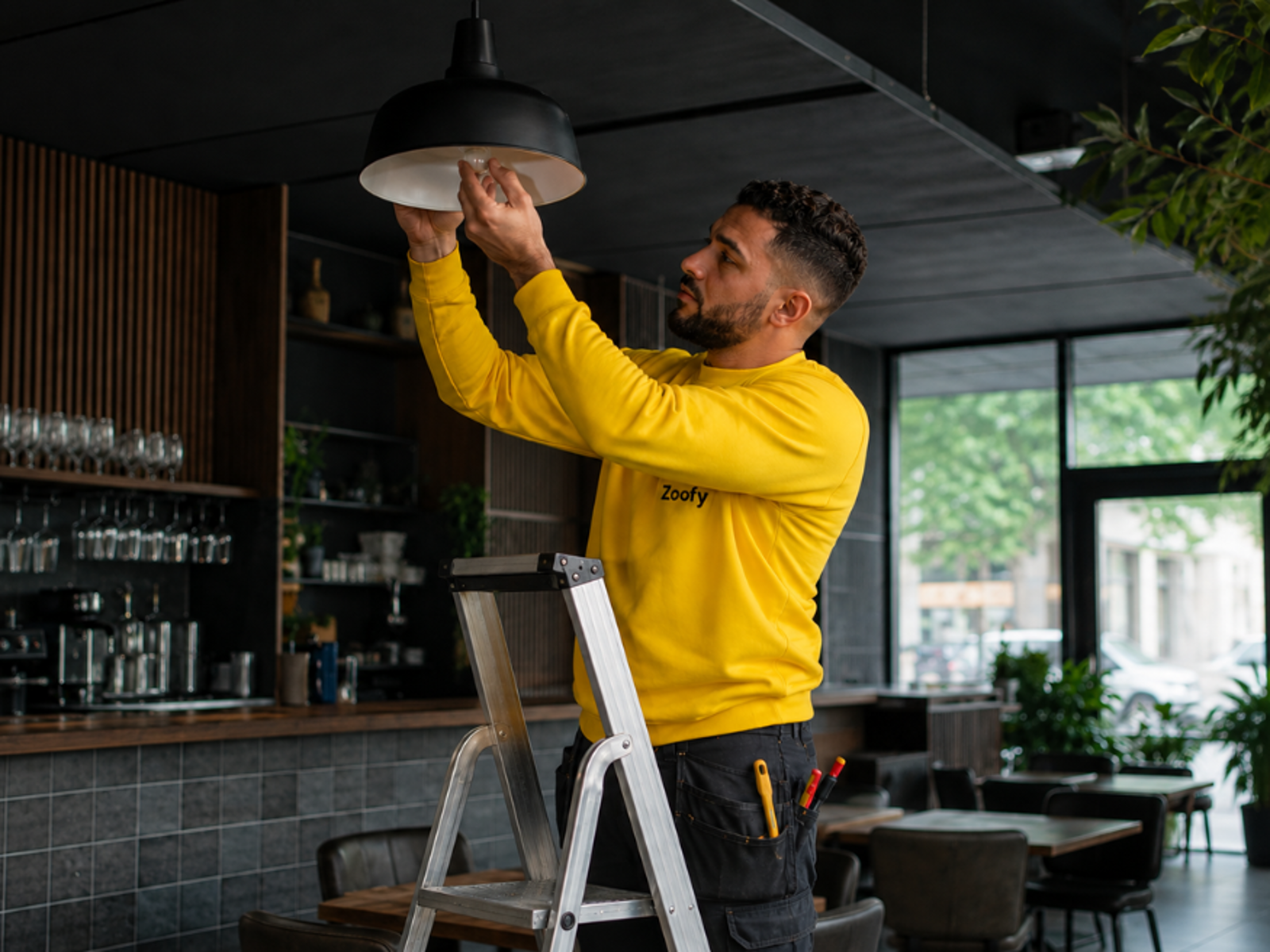 Zoofy professional carrying out maintenance in a hospitality venue